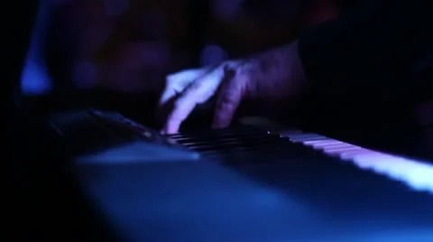 CU keyboard playing glide around hand low lighting Stock Footage 11136181