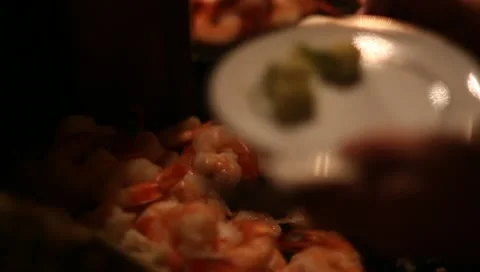 CU loading shrimp onto plate rack focus CU buffet Stock-Footage 11140046