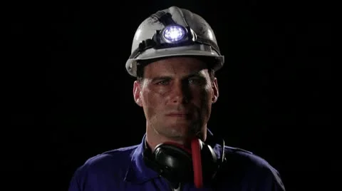 CU, Lockdown, Coal miner removing hardhat and wiping sweat off his upper lip Stock Footage 10703087
