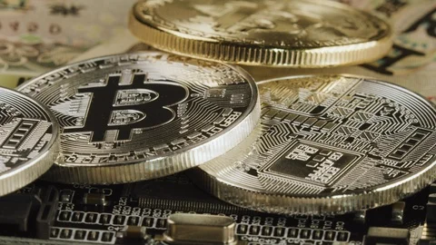 CU Macro Orbit of Silver and gold Bitcoin on a computer microchip board, backgro Video stock 122328380