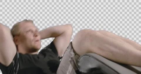 CU Man Doing Stomach Crunches on Exercise Bench with Alpha Channel 4K Stock Footage 57688313