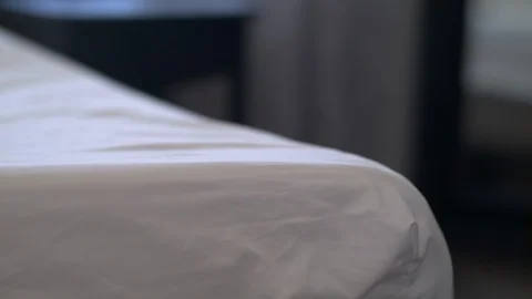 CU man lifting mattress towards camera 库存影片 125900265
