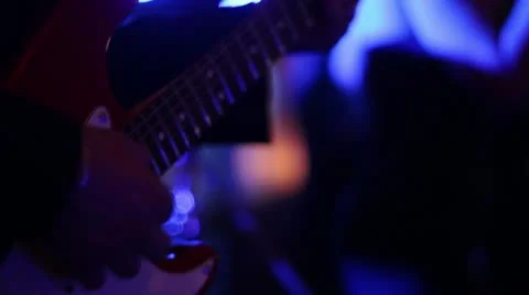 CU Man playing guitar at live event DJ lighting Stock-Footage 11136298