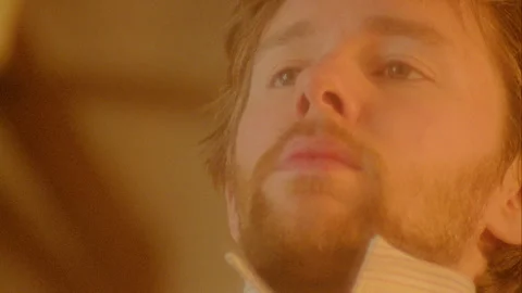 CU man put his tie on in the Mirror Stock Footage 272393508