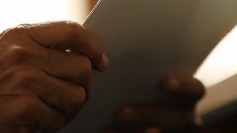 CU Man Reads Paperwork HD Video Stock Footage 92743735