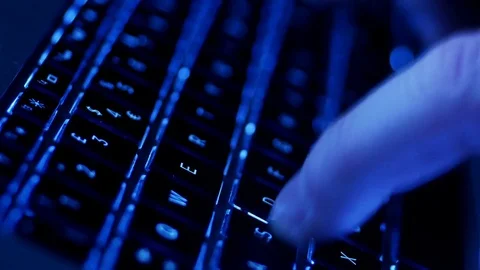 CU man typing on computer keyboard, blue Video stock 85168445