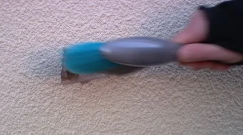 CU Man's hand with brush on wall Stock Footage 11924283