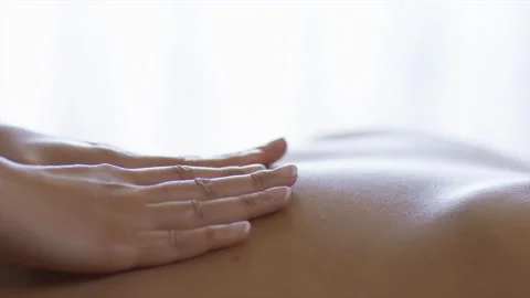 CU Masseuse hands giving back massage at spa Stock Footage 167341337