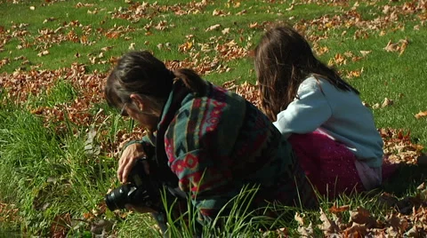 Cu-medium shot of mother and daughter taking phots in fall in New England Stock Footage 888640