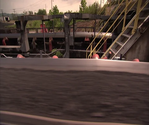 CU moving coal conveyor belt, widen out to MS Stock Footage 86693921