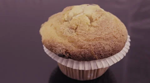 CU muffin cupcake parallax motion on reflective glass Stock Footage 55344258