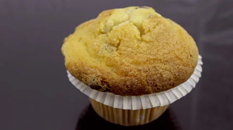 CU muffin parallax motion on reflective glass Stock Footage 55309427