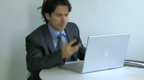 CU PAN OF A BUSINESS MAN WORKING Stock Footage