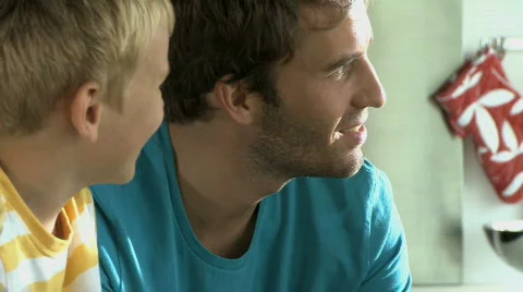 CU PAN OF A FATHER AND HIS CHILDREN TALKING Stock Footage 543335
