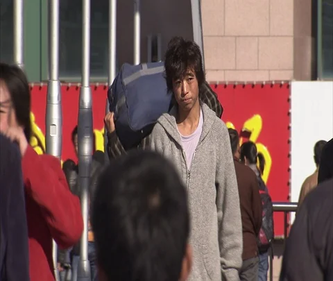 CU people with luggage walking out of Beijing Railway Station Stock Footage 86745138