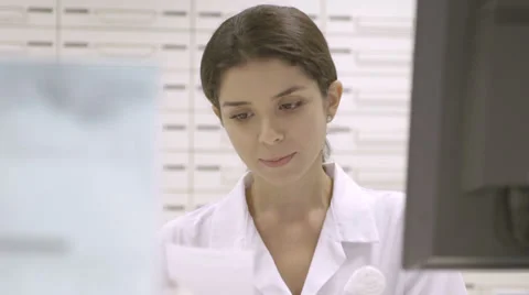 CU pharmacist working in pharmacy Stock Footage 31956279