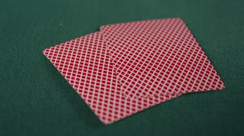 CU of poker chip being placed on two face down cards Stock Footage 53239530