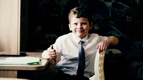 CU: Portrait of boy who is preparing to go to school, he smiles. Stock Footage 105101236