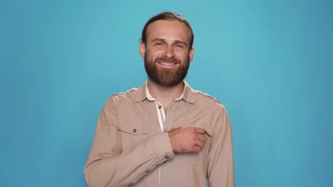 CU portrait of man smiling and taking out condom from his pocket and shows it Stock Footage 157883770