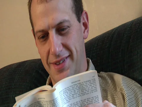 CU reading a book Stock Footage 37013837