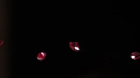 CU Red Rubies falling in slow motion HD 7 Stock Footage 253064824