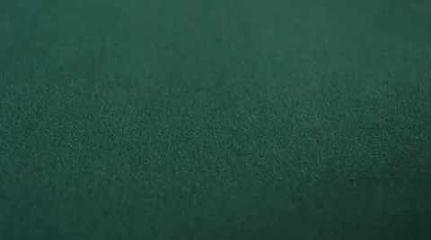 CU of red, white and blue chips being pushed across green felt table Stock Footage 53243411