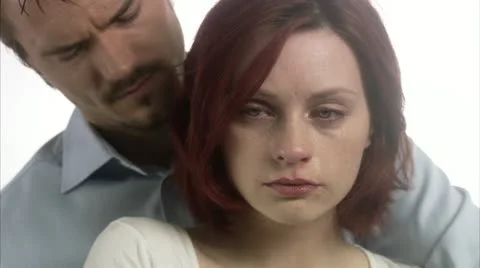 CU Sad couple hugging Stock Footage 11339766