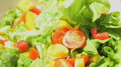 CU SALAD BOWL WITH CUCUMBER FALLING IN Stock Footage 541490