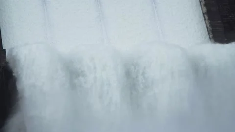 CU Shot, a large dam is discharged water from a pipeline Stock Footage 147965181