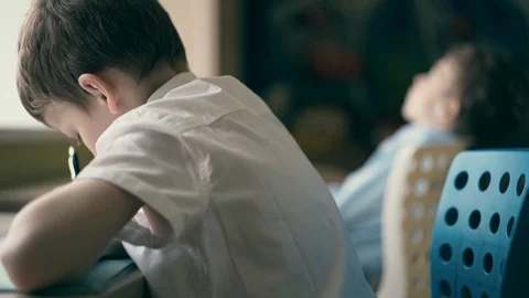 CU, Slow motion: Children do their homework, and listening audiobook. Stock Footage 105100019