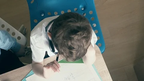 CU, Slow motion, High-angle shot: schoolboys sit at table in school uniform and Stock Footage 105096211