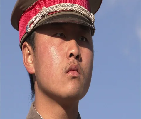 CU soldier stands guard in front of Shenhua Sanhe power plant Stock Footage 86745816