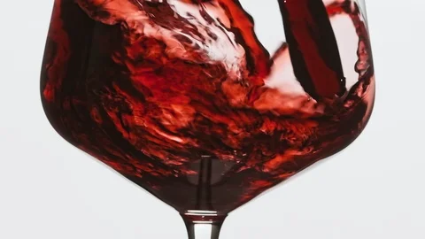 CU Sommelier pouring an excellent red wine in glass. Rose wine pour into glass. Stock Footage 116503523
