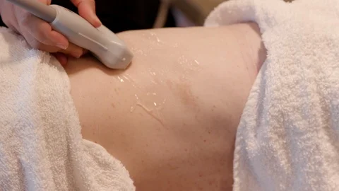 CU Sonographer Scans Woman's Back Stock-Footage 114180976