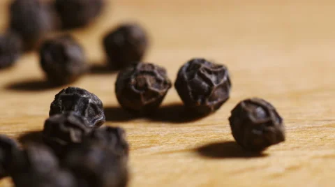 CU tracking black peppercorns Stock Footage 56143670
