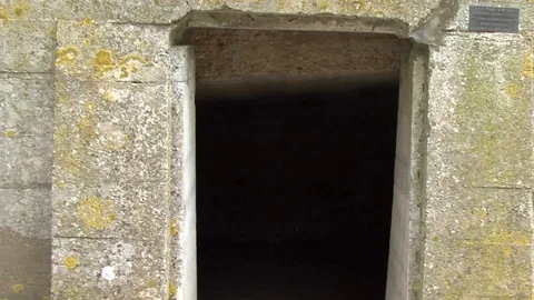 CU Tracking Shot Entering Memorial Structure in Essex Farm Cemetery in Belgium Stock Footage 97792631
