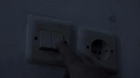 CU turning on room electric light wall switch pushing button Stock Footage 283268741