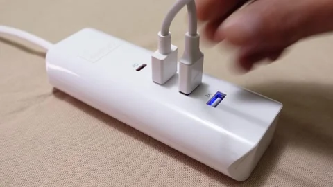CU of USB cable plugged into wall socket  Stock Footage 307437236