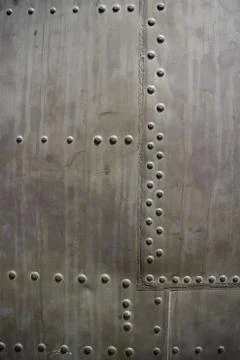 CU Vertical Detail of rivet pattern on captured USAF aircraft in Vietnam Stock Photos