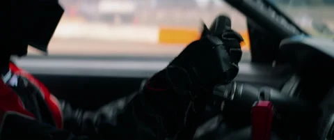 CU View of unrecognizable driver in protective wear racing on a speedway Stock Footage 146883556