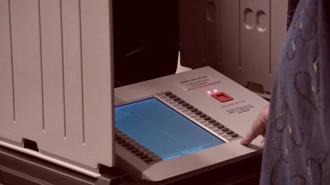 CU of voter pressing the OK button on avoting screen. Video stock 97726965