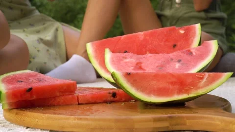 CU of watermelon. Hand is taking pice of watermelon Stock Footage 158886477