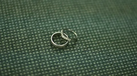 CU Wedding Bands Rings pan across on Fabric Vídeo Stock 11849735
