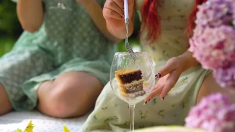 CU of wineglass with cake inside. asian woman is taking cake from glass Stock Footage 158886913