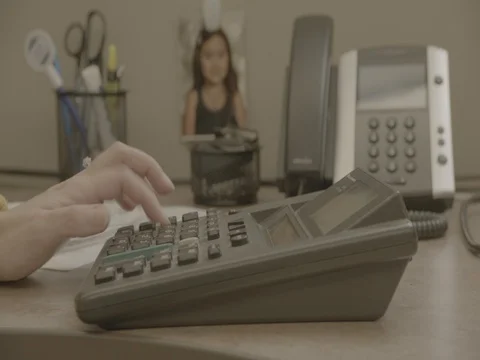 CU of Woman Typing on a Calculator Stock Footage 84520573