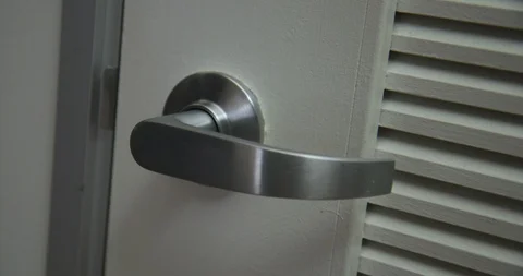 CU woman's hand opens and closes white louvered door in slow motion 4K Vidéo 90796845