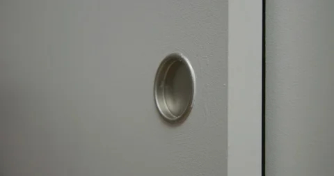 CU woman's hand opens and closes closet door in slow motion 4K Stock Footage 90957957