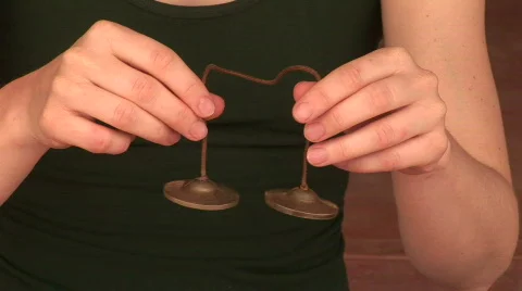 CU of Woman's hands ringing chimes Stock Footage 574520