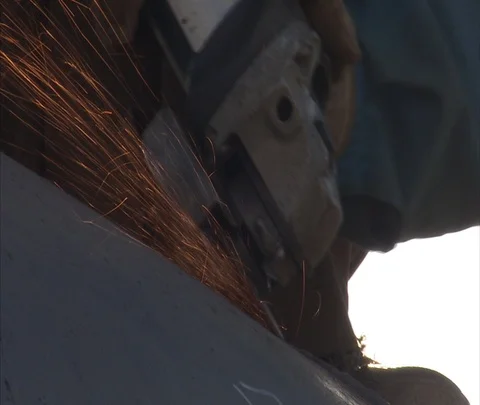 CU worker sanding pipe with sparks flying Stock Footage 86745965