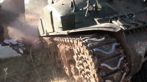 CU of World War Two era Sherman Tank tracks as it plunges through debris Video stock 57101691